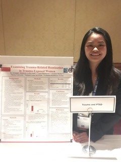 Joy with her research poster at the ABCT conference.