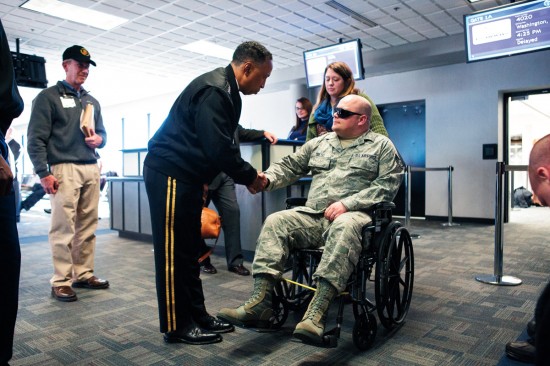 Via greets wounded veterans arriving at Huntsville International Airport last November during Heroes Week, an annual event sponsored by the local task force Semper Fi.