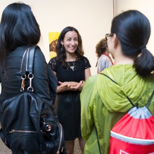 Artist Emily Freiberg (CFA’04) center, greeting guests at the opening reception for Ariel Freiberg: Unquenchable Thirst on view at the Sherman Gallery through October 25. Photo by Jackie Ricciardi