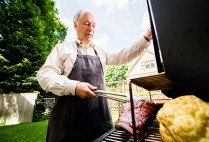 Greg Blonder, ENG physicist, has co-written a book about using science principles to barbecue and grill perfectly. He cooks pork ribs at his Brookline home