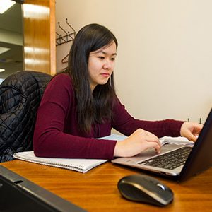 Rosy Chen (ENG’17) using a laptop