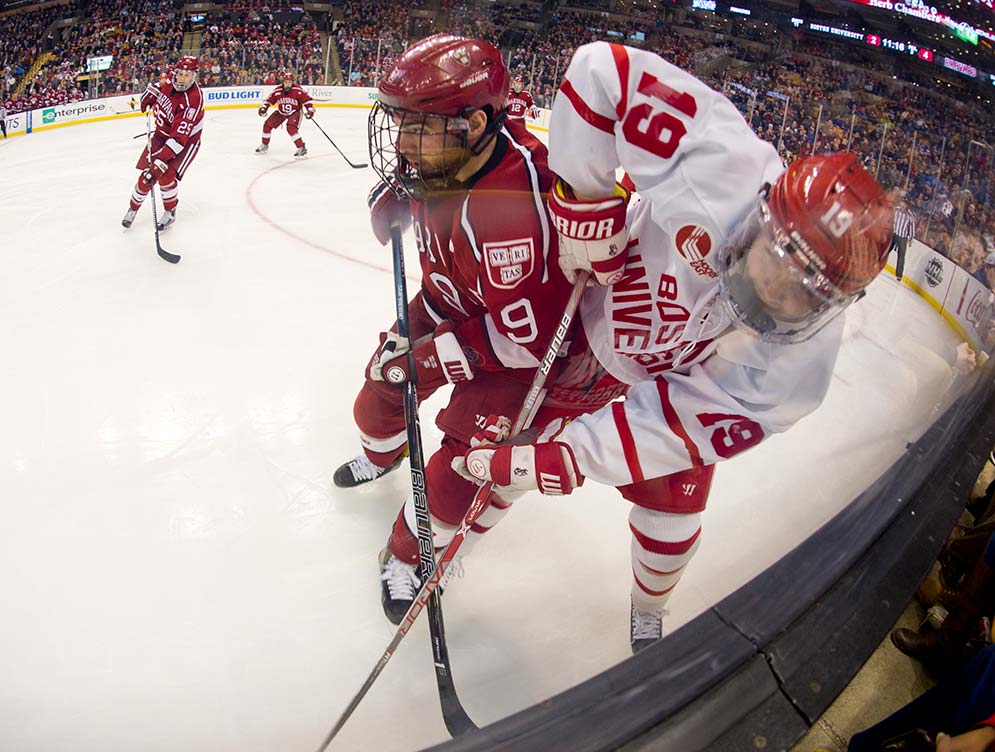 Clayton Keller fights for the puck up against the boards in Boston University's 6-3 loss to Harvard in the 65th Annual Beanpot Final