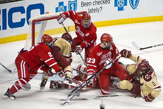 BU Terriers players battle Boston College players in front of the net during first round of the 2017 65th Annual Beanpot Tournament