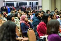 Students, faculty and staff watch a panel discussion on Donald Trump's Executive Order on Immigration during a Town Hall Meeting at Boston University