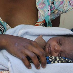 A mother in sub-Saharan Africa holds her infant