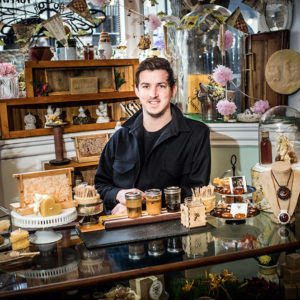Questrom grad student Brian Woerner is equally at home offering a tasting at Follow the Honey in Cambridge or working with locals in Tanzania to help produce a sustainable supply of organic honey