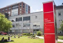 Students congregate on the COM Lawn at the Boston University College of Communication, Charles River Campus