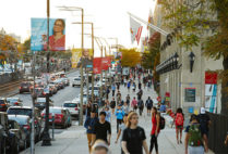 Students walk along Commonwealth Ave. on the Boston University Charles River Campus