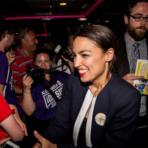 Progressive Democrat Alexandria Ocasio-Cortez celebrartes with supporters at a victory party in the Bronx after upsetting incumbent Democratic Representative Joseph Crowly on June 26, 2018 in New York City. Ocasio-Cortez upset Rep. Joseph Crowley in New York’s 14th Congressional District.