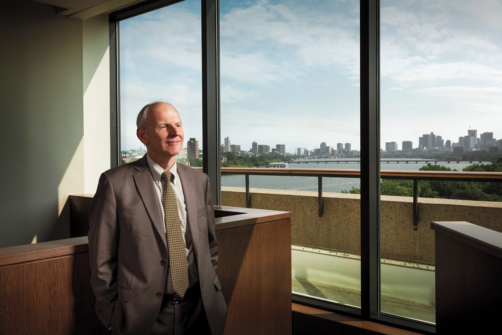 Portrait of Mark Pettit Jr. in front of the boston skyline over the charles river