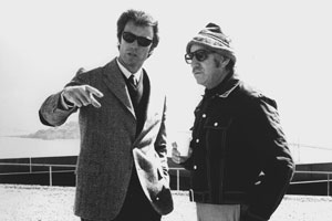 With San Francisco Bay in the background during location shooting, Don Siegel (right), producer-director of the movie Dirty Harry, listens to what Clint Eastwood has to say about the next scene. Photo courtesy of Warner Bros.