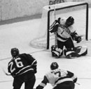 Pucker up. In his debut as a Terrier goalie, Stephan Siwiec (CAS’06) made some great saves -- including the deflection shown (see the puck above the left corner of the net) -- to ensure a 6-4 win over the University of Nebraska on October 25 at Walter Brown Arena. Canadian Siwiec graduated from National Sport School in Calgary, a grade 9 to 12 school whose students must be recommended and receive sanction from an eligible Canadian Olympic sport governing body. Photo by Phoebe Sexton (UNI’06) 