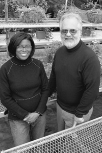 Gillian Isabelle, the owner of the Roslindale greenhouse Edenscapes, is one of 14 small business owners participating in InnerCity Entrepreneurs, a technical training and networking program created by Dan Monti, a CAS sociology professor (right). Photo by Frank Curran 