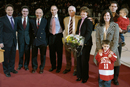 At the March 3 pregame ceremony announcing the naming of the Jack Parker Rink (left to right): Fred Chicos, chairman of the Board of Trustees athletics committee, Joseph Mercurio, BU executive vice president, Aram Chobanian, president ad interim, Mike Lynch, director of athletics, Parker (SMG68, Hon.97), Parkers wife, Jacqueline, daughter Jacqueline (SED94), son-in-law Scott Lachance (CAS94), a forward for the Columbus Blue Jackets, and grandsons Jake (wearing Lachances BU jersey) and Shane. Photo by Kalman Zabarsky