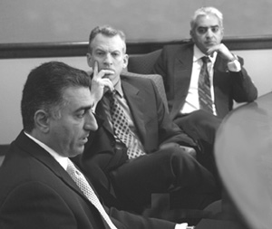 James Johnson (center) and Sassan Tabatabai, an instructor in the CAS Core Curriculum, listen to Reza Pahlavi (left), the eldest son of the former shah of Iran, discuss the Future of Democracy in Iran at a forum last April. Photo by T. J. Kirkpatrick