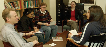 James Johnson, a CAS assistant dean and director of the Core Curriculum (from left), discusses the Core Current Affairs Associations upcoming lectures with Nashila Somani (CAS07), Andrew David (CAS06), Liberty Davis, Core Curriculum program administrator, and Mayse Yaraghi (CAS07). Photo by Kalman Zabarsky