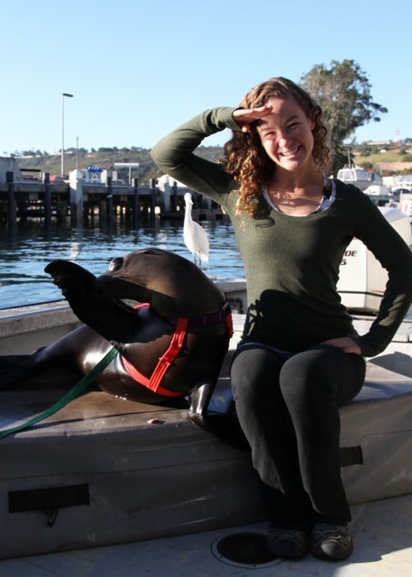 Julie O'Neill and a Navy Seal Lion in San Diego. Julie was an intern with the Navy's Marine Mammal Program, where she learned basic elements of marine mammal training and husbandry. (courtesy of US Navy)