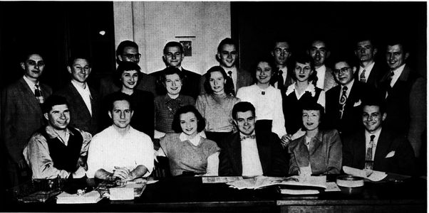 Yearbook Photo of Boston University NEWS staff. Ed Hymoff is seated on the far left of the front row. 1949 Hub: Senior Annual of Boston University, Vol. XIX. Boston: n.p., 1949. Yearbook Photo of Boston University NEWS staff. Ed Hymoff is seated on the far left of the front row. 1949 Hub: Senior Annual of Boston University, Vol. XIX. Boston: n.p., 1949.