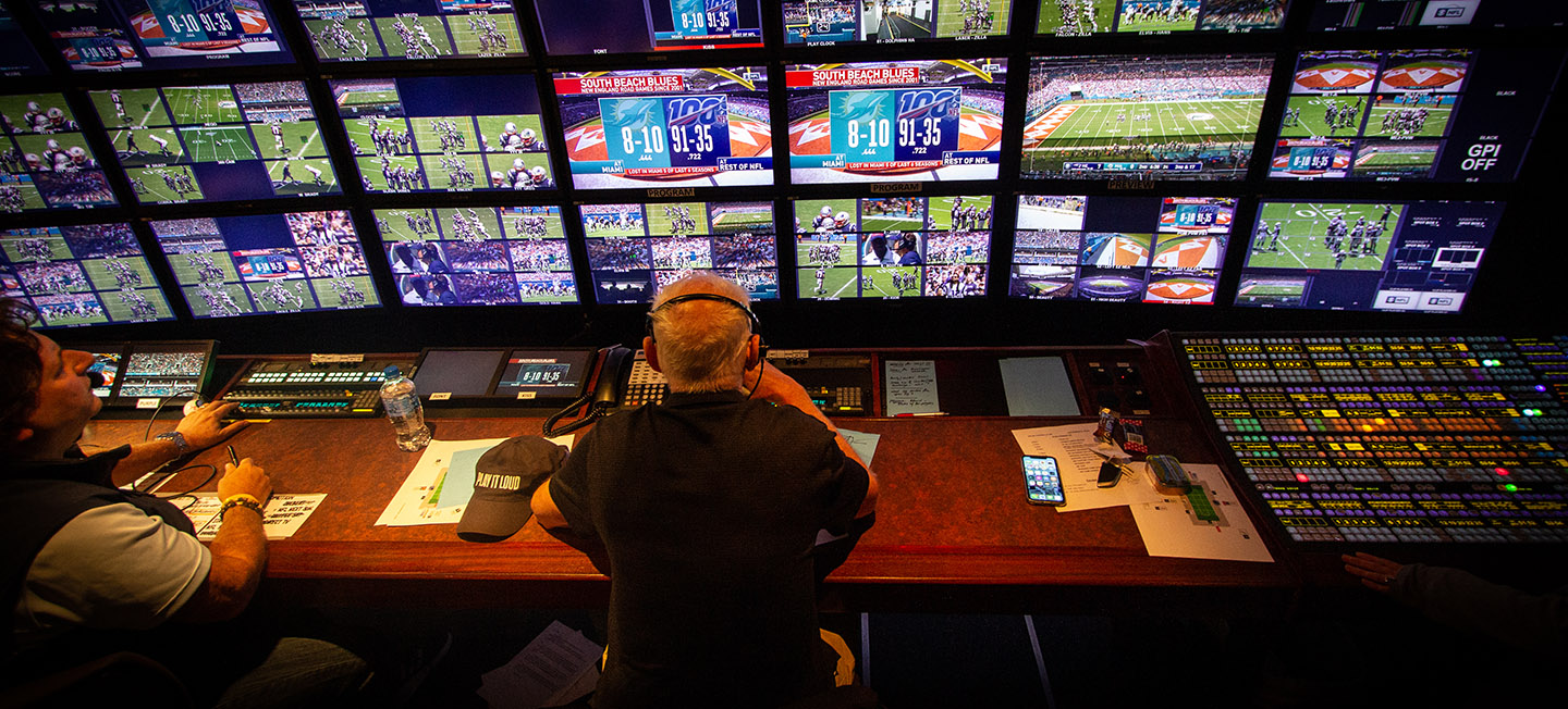 Bob Fishman sits in the control room during an NFL game.