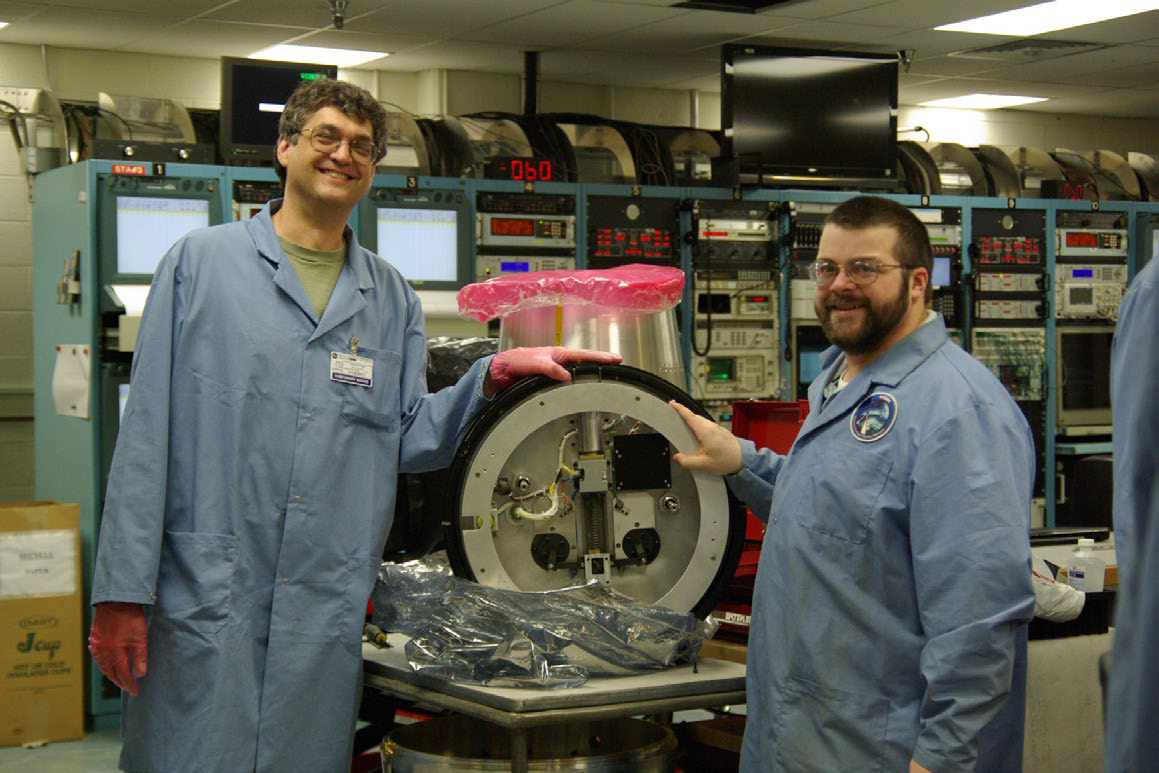 PICTURE Dr. Tim Cook and Andrew Mandigo posing with the shutter door.