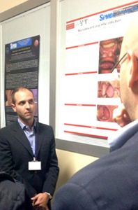 Dr. Alessandro Villa presents his award-winning poster at the Italian Association of Oral Medicine and Pathology Meeting