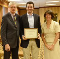 Mohamed Bayoumy DMD 16 with award presenters Dr. Timothy Hottel (left) and Dr. Jane Puskas (right)