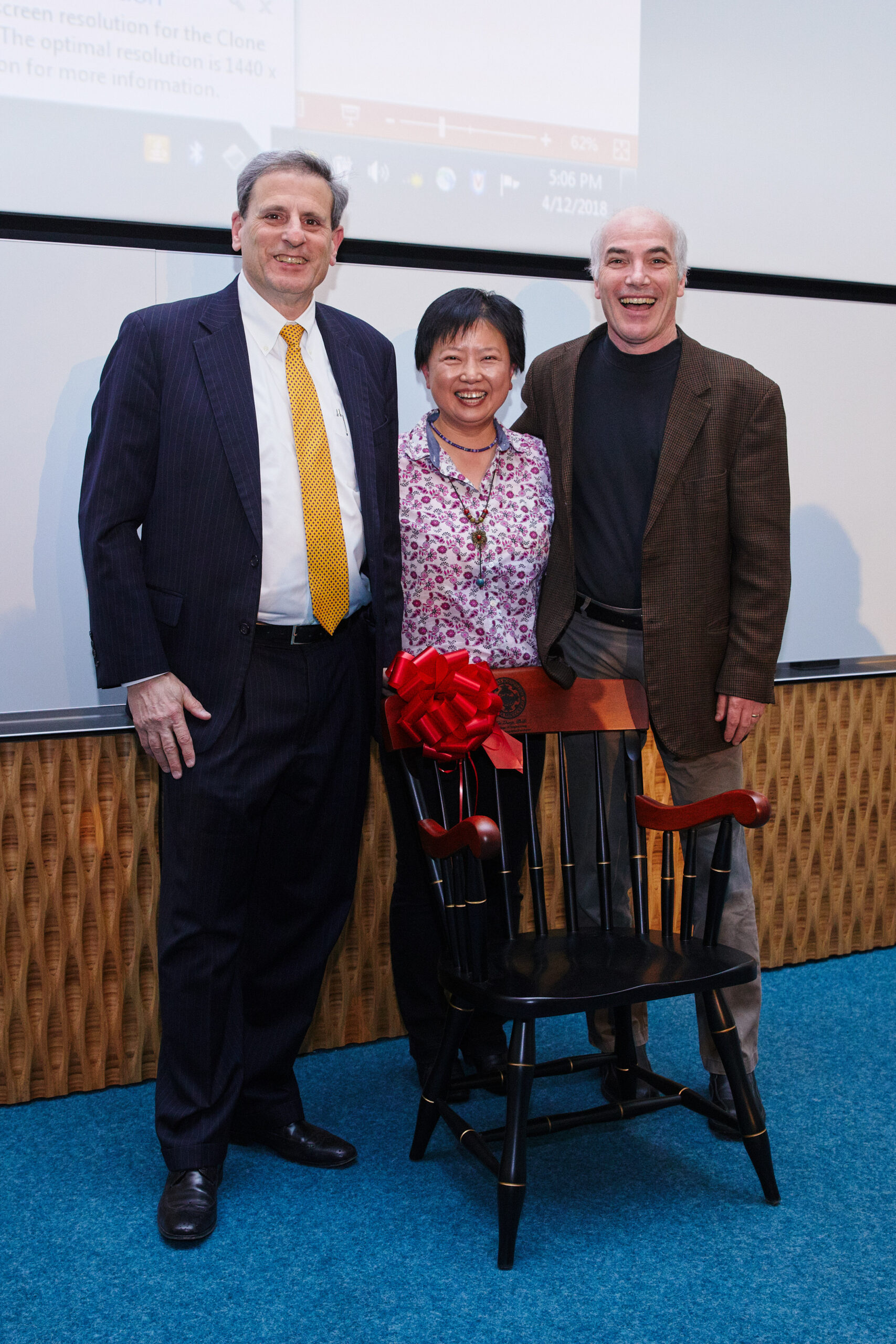Professor Xin Zhang (center) is presented with the DeLisi Lecture gift by Dean Kenneth R. Lutchen (left) and Director of the Photonics Center and Professor Thomas Bifano (ME, MSE, BME). Photo by Dave Green