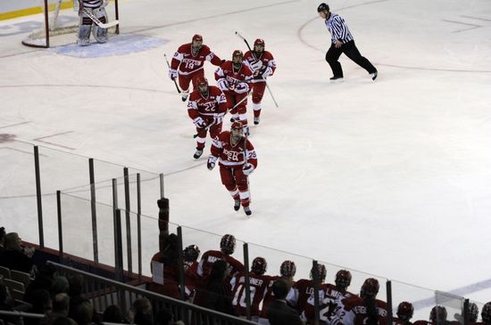 Marie-Philip Poulin led teammates back to bench after she scores the only BU goal of the game.