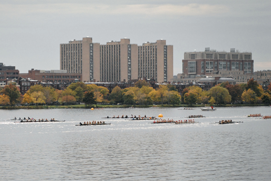 Crew teams practice on the Charles River for the Head of the Charles Regatta.
