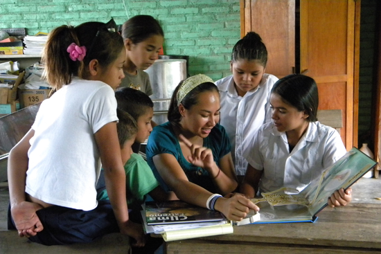 Gomez (center) says she was inspired to create Educate2Envision after her first visit to Honduras in 2009. Courtesy of Educate2Envision