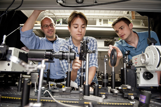 Luca Dal Negro and students in lab, Associate Professor Electrical and Computer Engineering, Boston University BU College of Engineering ENG