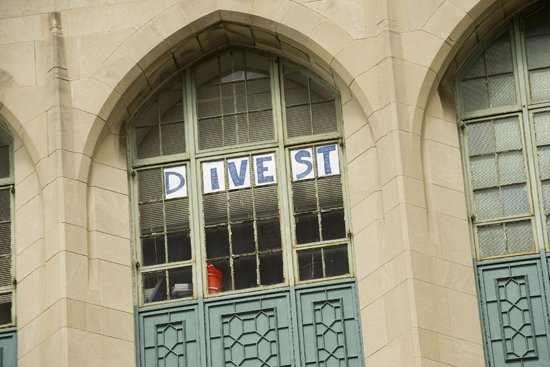 Divest sign, Nathan Phillips professor of earth and environment, Boston University, Divest BU, Boston University student groups organizations, college and university campus fossil fuel divestment movement, divest university endowments from fossil fuel investments, climate change action