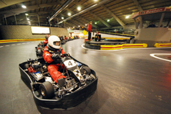 things to do near Boston University BU, professionally designed indoor racecar kart tracks, F1 Pro League action,City Course, Country Road Course