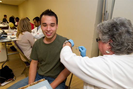 a student gets a flu shot during a boston university flu clinic