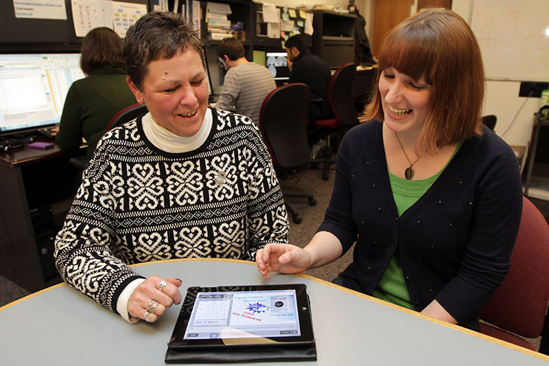 Carrie Des Roches, a research assistant in the Aphasia Research Laboratory and one of the study’s authors (right), with Damon.