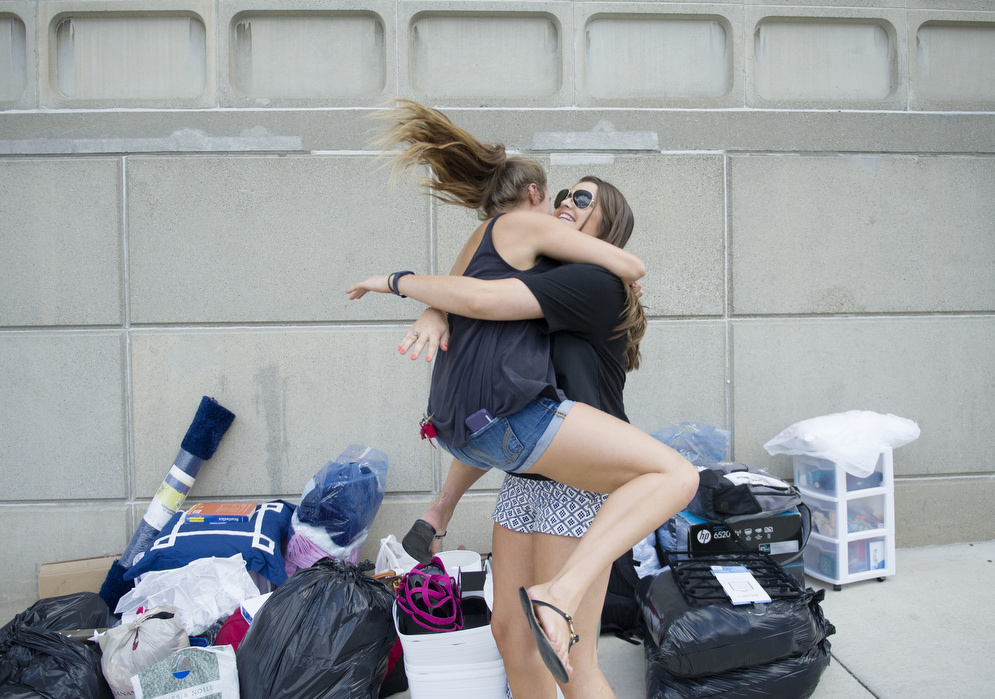 Samantha Brooks (CGS 18) (left) reunites with her best friend Julia McMahon (SAR 18) during move in on Friday, August 28, 2015 Photo By Jackie Ricciardi for Boston University Photography