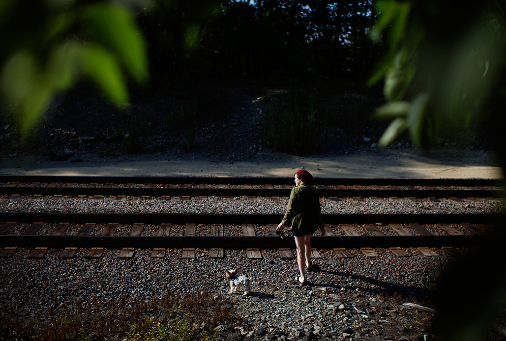 Kayla Furbish walks her dog Jake