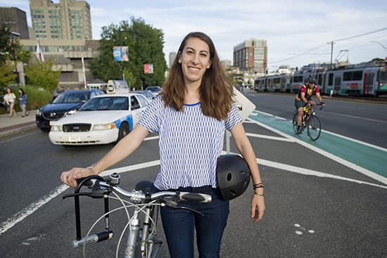 Carly Sitrin (COM'17) talking bike safety on Commonwealth Ave Boston