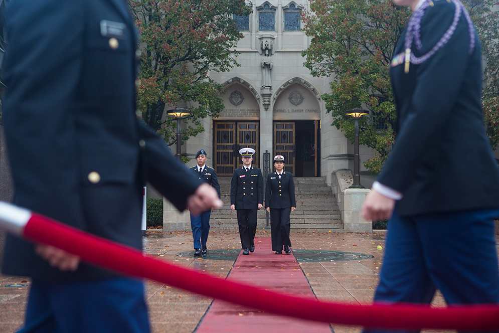 Army Cadet Captain Justin-Ryan Abueg (CAS'16), (from left) escorts Peter Kellner Marine ROTC MIDN 3/C Peter Kellner (CAS'18) and Navy MIDN 4/C Isabelle Nguyen-Phuoc (CAS'19) as they begin their assignment to relieve fellow cadets of their marching duties in front of Marsh Chapel on Wed. Nov. 11, 2015 during the Veterans Day Vigil where cadets and midshipmen took turns in 15 minute increments marching in silence for 5 hours. Photo by Jake Belcher.