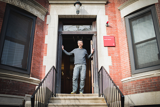 Nathan Phillips poses for a photo in front of the Earth House on Friday, January 15, 2016. It is a residential education program at 7 Buswell St., where accepted environmental studies students will live and study the house itself, among other things, as part of a two year program of seminars and "experiential projects." Photo By Jackie Ricciardi