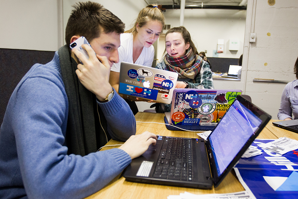 In the basement of 518 Park Dr, Keith Drucker (CAS'17) from left, Annalise Routenberg (CAS'17), and Madeline McGill (CAS'16) with BU for Hillary call volunteers to encourage them to continue supporting Clinton by joining the campaign with some upcoming canvassing events January 24, 2016.