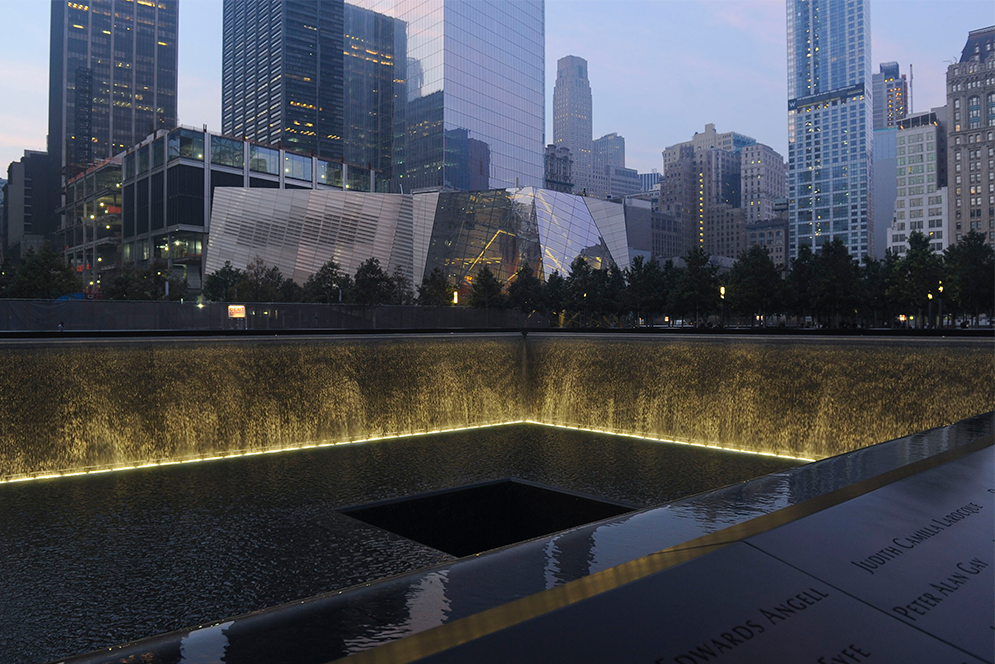 A view of 9/11 Memorial Plaza from the North Pool at night