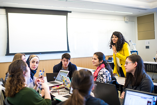 Noora Lori (right), CAS assistant professor of international relations at the Pardee Center for Global Studies, and her students worked to create an app to help urban refugees find services.