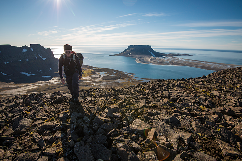 Author and science writer David Quammen climbing to the top of the plateau of one of the islands of Franz Josef Land