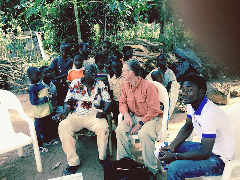 Author and science writer David Quammen interviewing the chief of a small village on the Ivory Coast