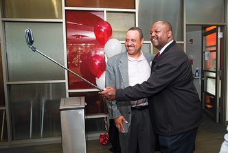 Albert James (ENG’85, Questrom’95) (left) and Terry Anthony (ENG’86) snap a selfie