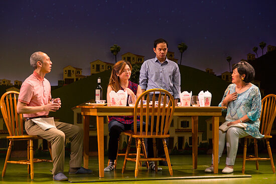 Francis Jue, Quian, Schneider, and Emily Kuroda on stage in Tiger Style! in a scene where they are eating Chinese take out on a dining room table