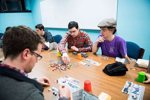 Students in the BU Board Games Club playing strategy board games