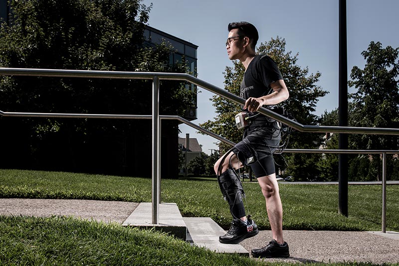 Man walking in a medical exosuit designed to help stroke victims walk