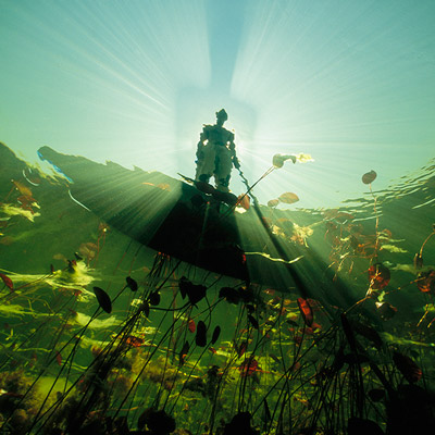 Breathtaking fisherman silhouette shot from underwater